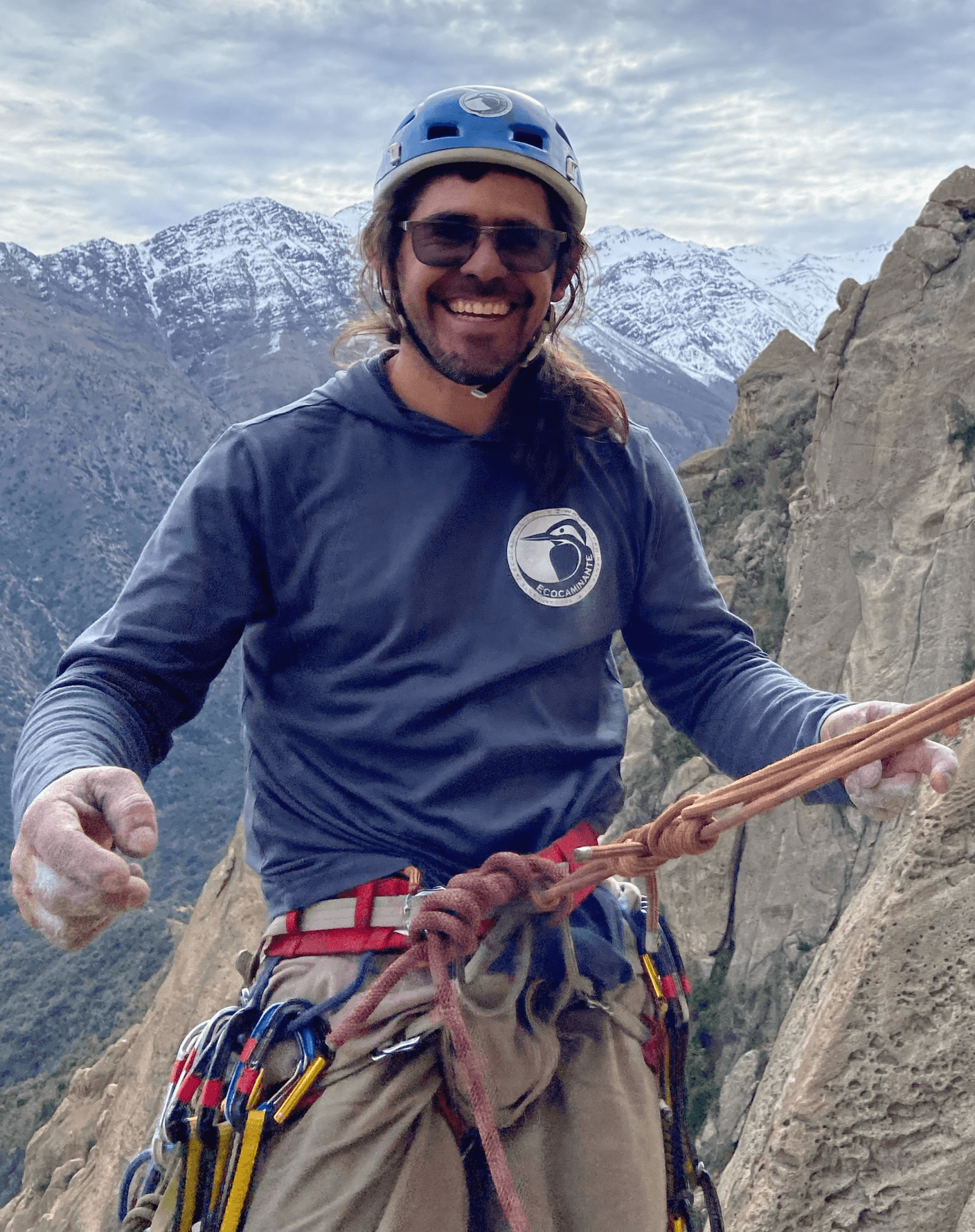 Jaime Acevedo Riquelme smiling while guiding on a rock climb in the Andes.